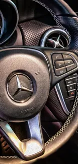 Close-up of luxury car steering wheel with modern design features.