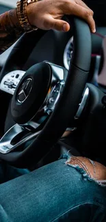 Close-up of a luxury car steering wheel and controls.