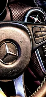 Close-up of a luxury car's steering wheel with intricate details.