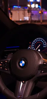 Luxury car steering wheel with night city lights.