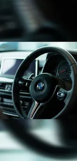 Close-up view of a luxury car steering wheel and dashboard.