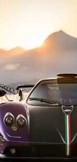 Luxury sportscar parked at sunset with scenic mountain view.