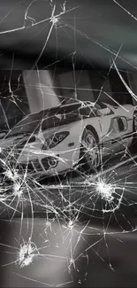 Luxury sports car with cracked glass effect in black and white tones.