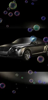 Black luxury car with colorful bubbles on sleek background.