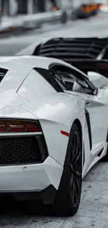 Luxury sports cars parked in an urban setting