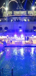 Illuminated luxury cruise ship with pool at night.