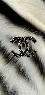Black and white faux fur with monogram logo.