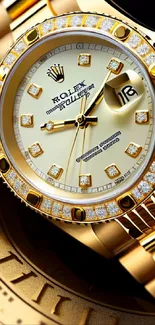 Golden watch with diamonds on bezel, elegant design.