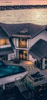 Luxurious overwater bungalow at sunset with ocean view.