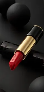 Luxury red lipstick on black background with gold accent.