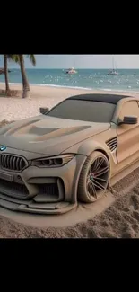 Artistic sand car sculpture on beach with ocean view.