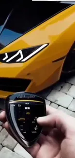 Yellow sports car with digital key, showcasing sleek design and technology.