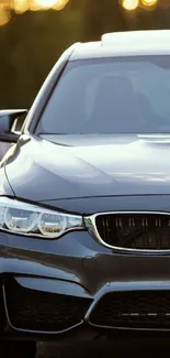 Front view of a luxury sports car on wallpaper.