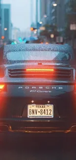 Luxury sports car in urban rain, city backdrop