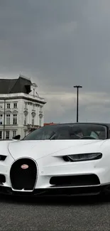 Sleek Bugatti sports car on an urban street under an overcast sky.