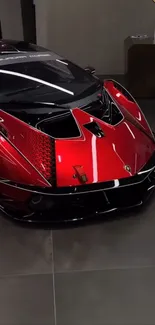 Luxury red and black sports car in showroom wallpaper.