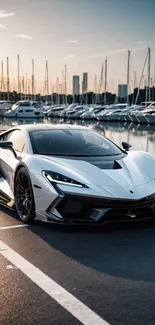 Luxury sports car parked by a marina during sunset.