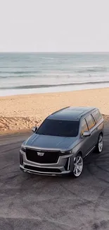 Luxury SUV parked on a beach with ocean in the background.