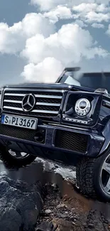 Luxury SUV on rocky terrain under a dramatic sky.