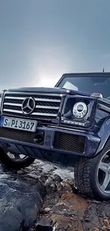 Luxury SUV on rocky terrain with a dramatic sky.