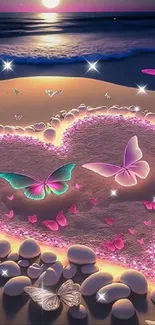 Heart and butterflies glowing on a sandy beach at night.