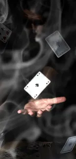 Hand casting floating playing cards with smoke effect.