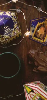 Magical wallpaper featuring chocolate frog, wizard card, and fairy lights on dark wood.