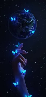 Hand with glowing blue butterflies under Earth in starry night sky.