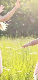 Children in a sunlit field with pink dresses and sparkling light.