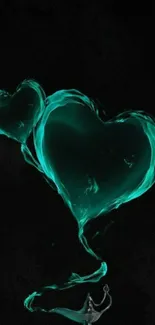 Teal heart-shaped smoke rising from a lamp on dark background.