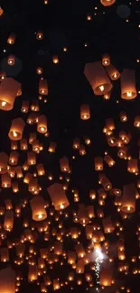 Floating lanterns fill the night sky creating a mesmerizing and magical ambiance.