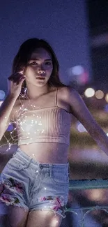 Woman with fairy lights against a night city skyline, creating a magical glow.