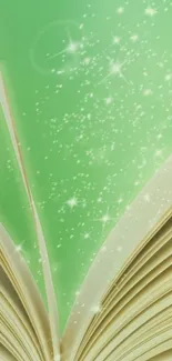 Open book with green sparkles wallpaper.