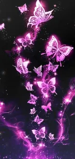 Magical pink butterflies on dark background wallpaper.