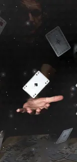 Floating playing cards with hand in dark magical scene.