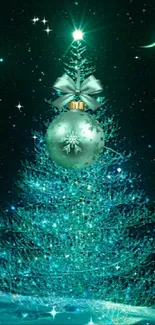 Snowy Christmas tree wallpaper with a teal ornament and crescent moon.