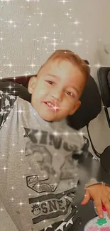 Joyful child with starry sparkles posing playfully.