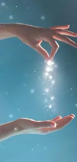 Hands releasing magical sparkles against a teal blue background.