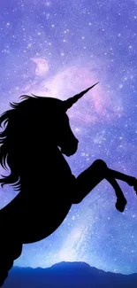 Silhouette of a unicorn against a vibrant, starry purple galaxy backdrop.