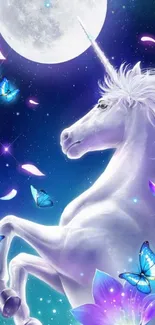 Majestic unicorn under moonlit sky with butterflies and flowers.