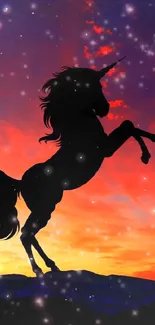 Silhouette of a unicorn against a vibrant sunset sky with stars.