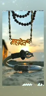 Mahadev pendant with bracelets against a soft sky.