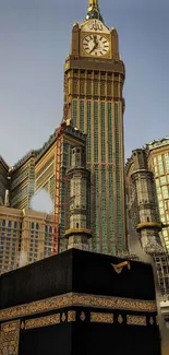 Abraj Al Bait towers with Kaaba in the foreground at Mecca's cityscape.