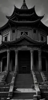 Majestic ancient temple with dramatic clouds and stone steps, in grayscale.