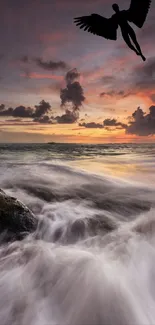 Angel silhouette flying over vibrant sunset ocean waves.