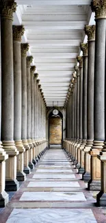 Elegant corridor with stone columns and classic architecture.