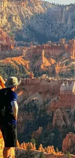 Man hiking in a picturesque canyon landscape at sunrise.