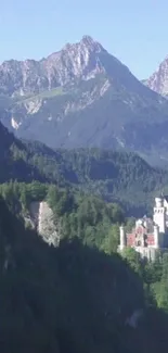 Castle nestled in green mountains under a clear sky.