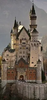 Majestic castle wallpaper with a scenic mountain backdrop.