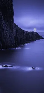 Misty blue nightscape with cliff and ocean